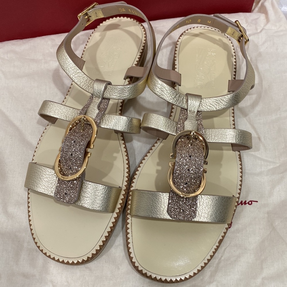 Salvatore Ferragamo brand new gold flat authentic sandals with buckle